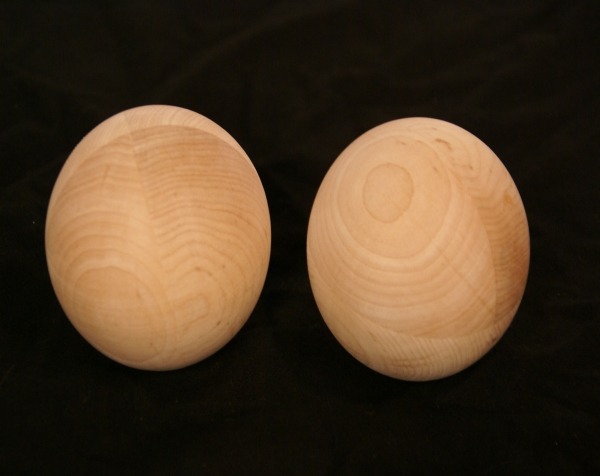 Pair of unfinished wooden balls, available in bulk for manufacturers and large-scale production runs.